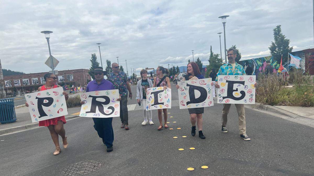 Members of the Bellingham City Council march in the Bellingham Pride Parade Sunday, July 17, near Waypoint Park. Holding the signs are Kristina Michele Martens, left, Skip Williams, Hannah Stone, Hollie Huthman and Michael Lilliquist.