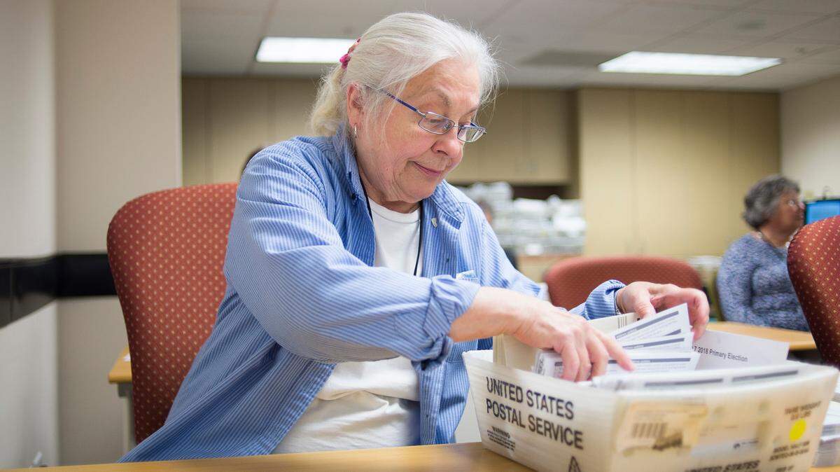 Janet Jungkuntz, a temporary election worker, sorts ballots at the Whatcom County Courthouse on Tuesday in Bellingham.