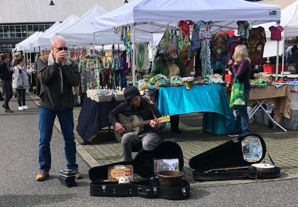 Buskers perform at the Bellingham Farmers Market on opening day Saturday, April 2, at Depot Market Square.