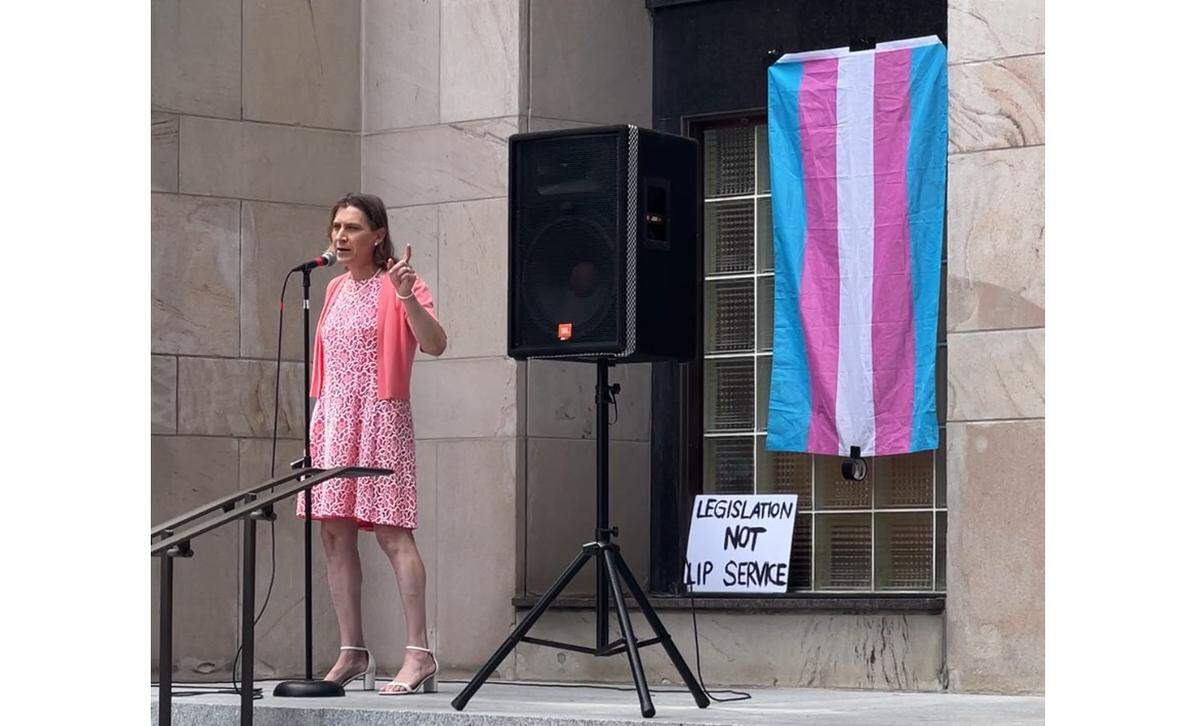 Cori Lovejoy of Bellingham addresses about 100 people regarding transgender rights from the front steps of City Hall on Monday, June 16.
