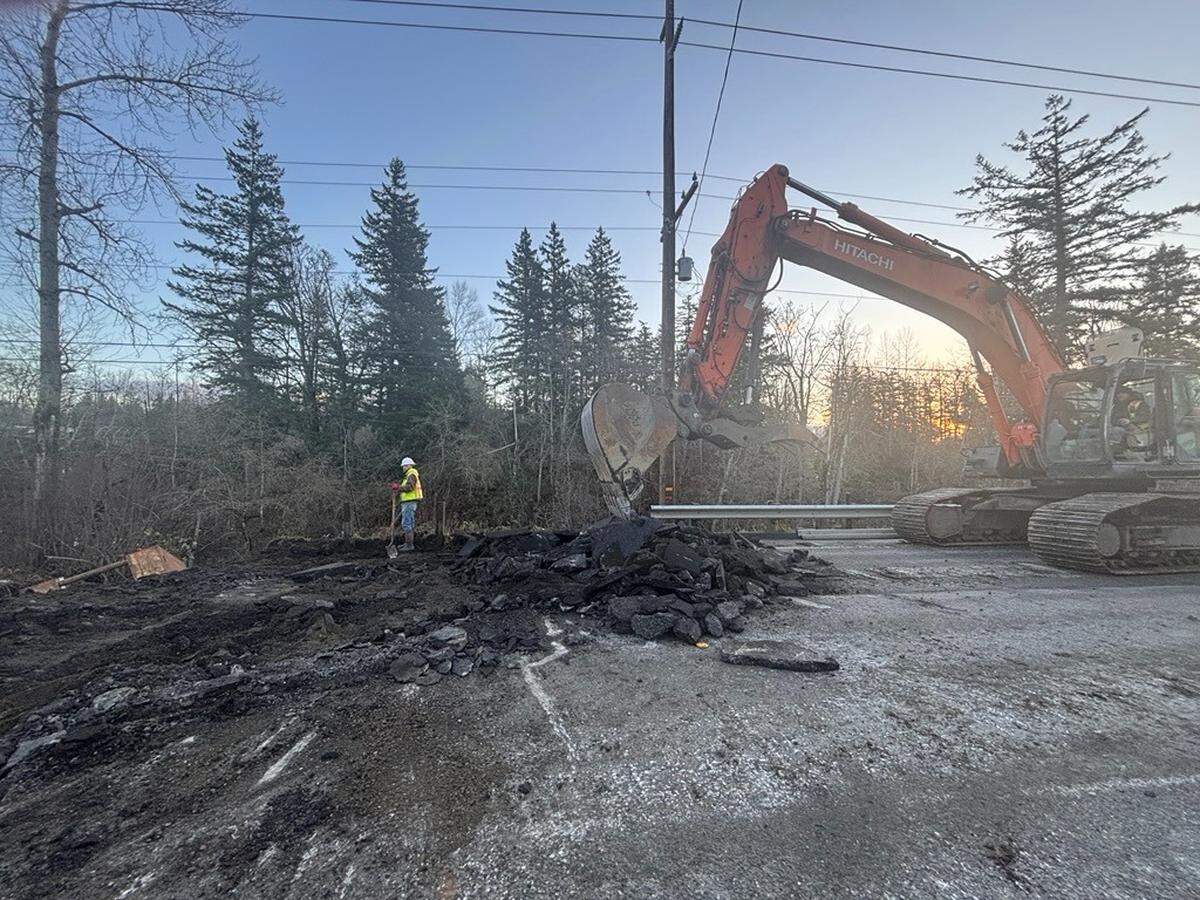 A city crew works at a sinkhole where Hannegan Road was undermined north of Bakerview Road, in an undated photo from the city of Bellingham’s social media.