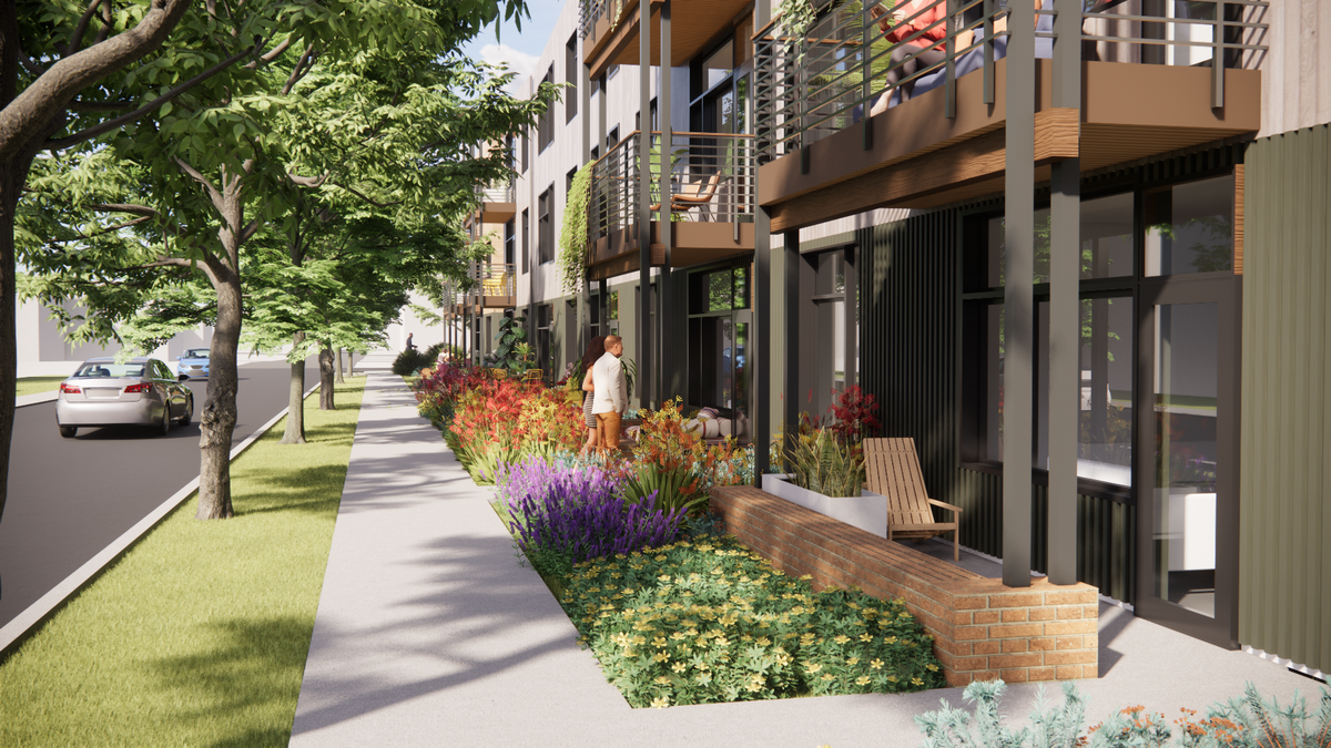A rendering shows a front porch view of the proposed design for 4th Corner Commons in Bellingham. Construction is expected to begin in spring 2027.