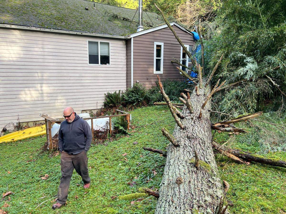 Dwayne Campbell of Sudden Valley examines the damage to his home on Wednesday, Nov. 20, 2024, on Meadow Court east of Bellingham, Wash.