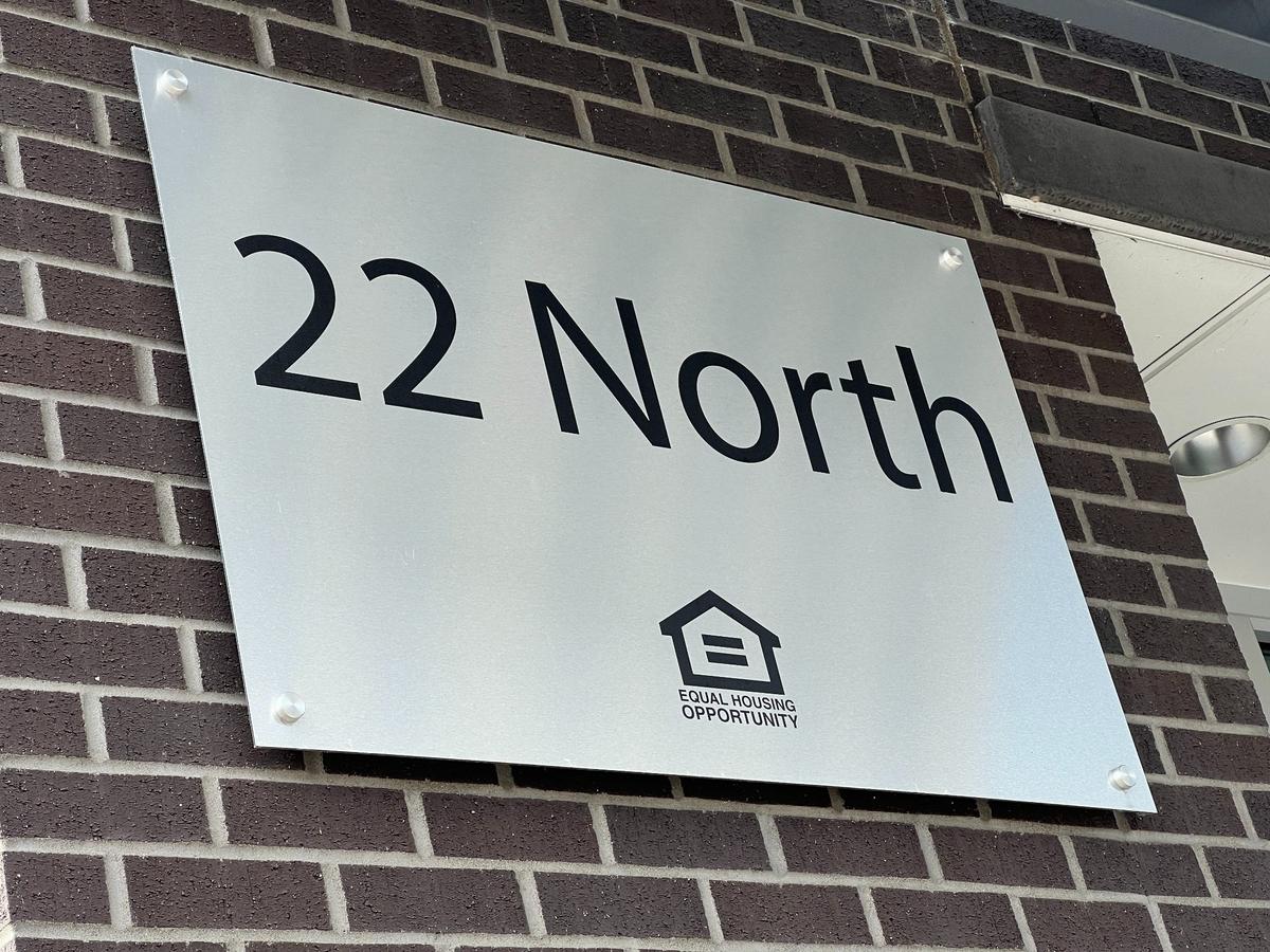 A sign outside 22 North says it is an equal housing opportunity.