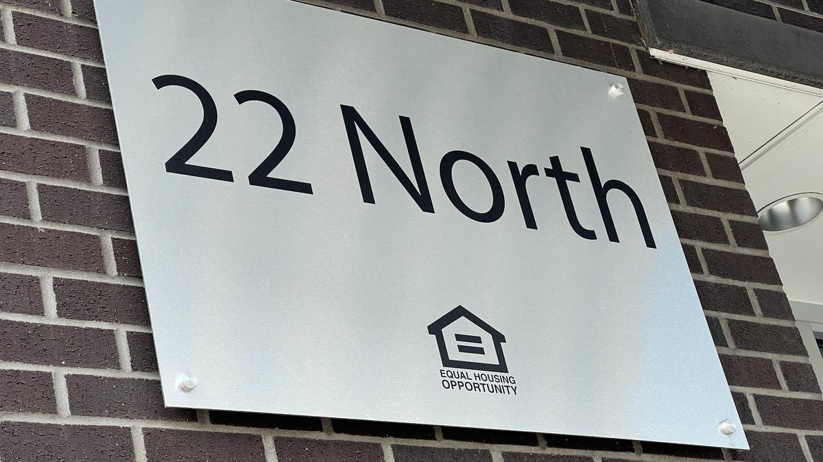 A sign outside 22 North says it is an equal housing opportunity.