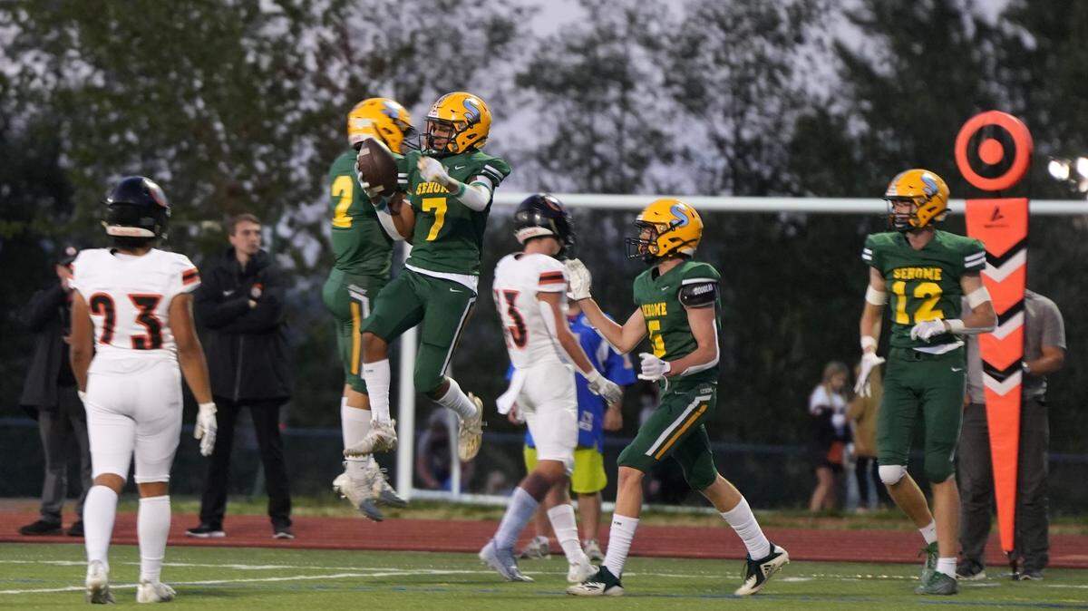 Sehome Mariners players Andre Watson, 7, and Nolan Wright, 2, celebrate a touchdown in a game against the Blaine Borderites on Sept. 7, 2023, at Civic Stadium in Bellingham, Wash. Sehome beat Blaine 44-6.