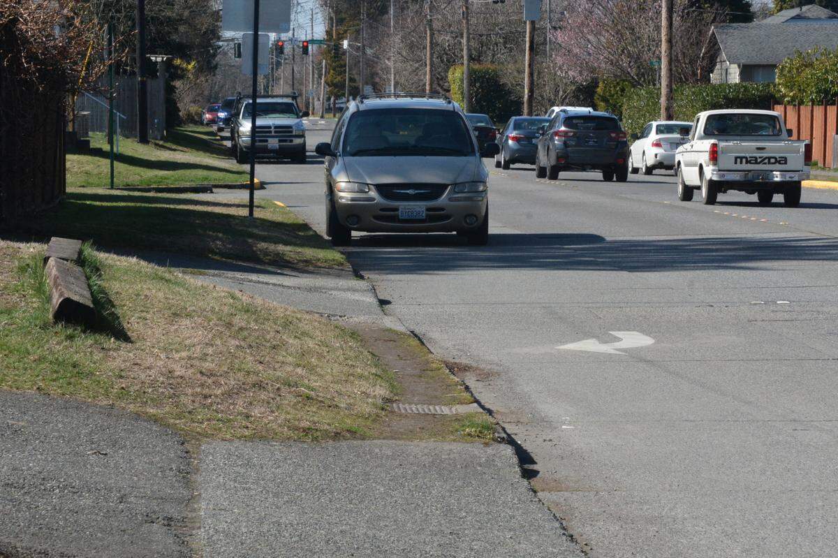 West Illinois Street is shown looking west from Meridian Street on Thursday, March 23, in Bellingham. A summer project will add a sidewalk to the south side of the street and bike lanes to both sides. Parking will be removed on the north side of the street.