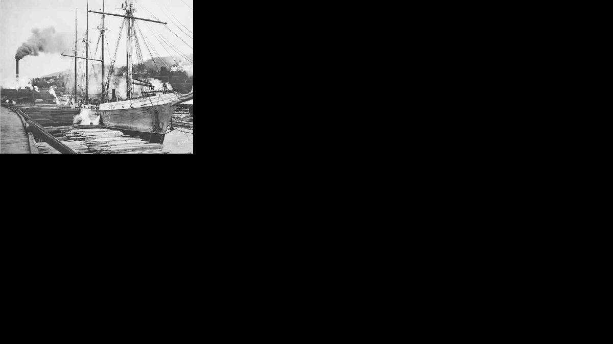 Around 1930, one of the last working schooners to visit Bellingham came to the Bloedel Donovan lumber dock on Bellingham's waterfront The white building visible on the hill is the old St. Joseph Hospital.