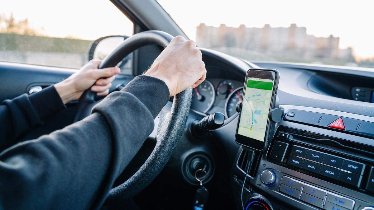 In California, you’re allowed to use your phone while driving if the device is mounted on your vehicle’s windshield, dashboard or central console.