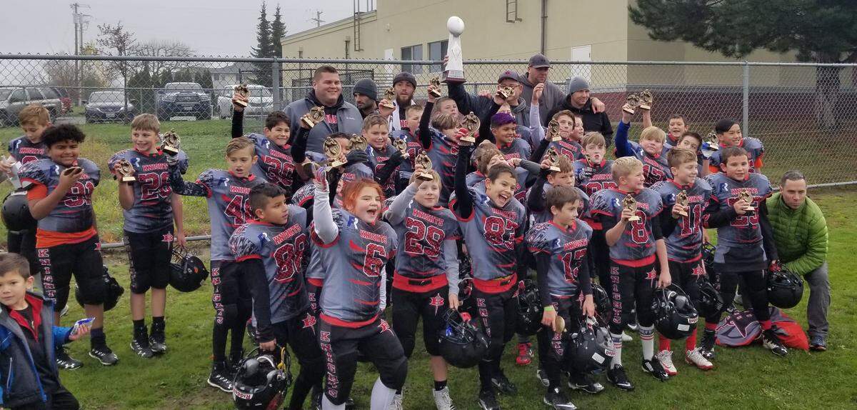 The Bellingham Knights youth football celebrates winning a regional championship in late November in Everett. The Knights, who are made up of 9- and 10-year-old players, head to Canton, Ohio, this week to play in the 2018 World Youth Championship.