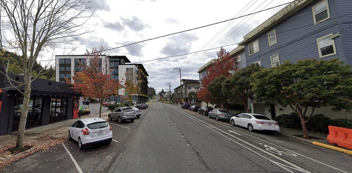 A rendering of the proposed State Street Creamery housing project is seen among the already developed buildings along N State Street in Bellingham, Wash.