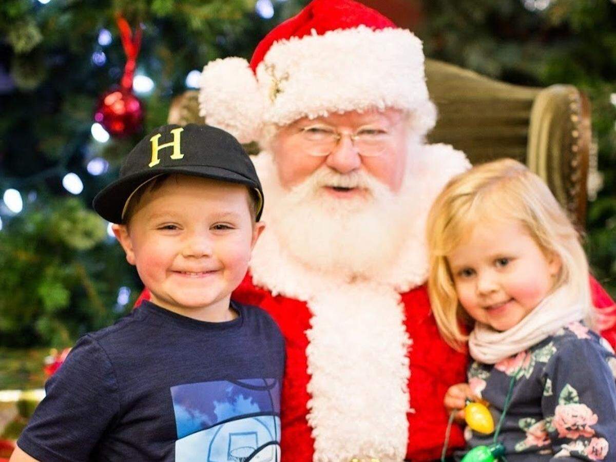A photo of children with Santa at Bellewood Farms and Distillery in Lynden, Wash.