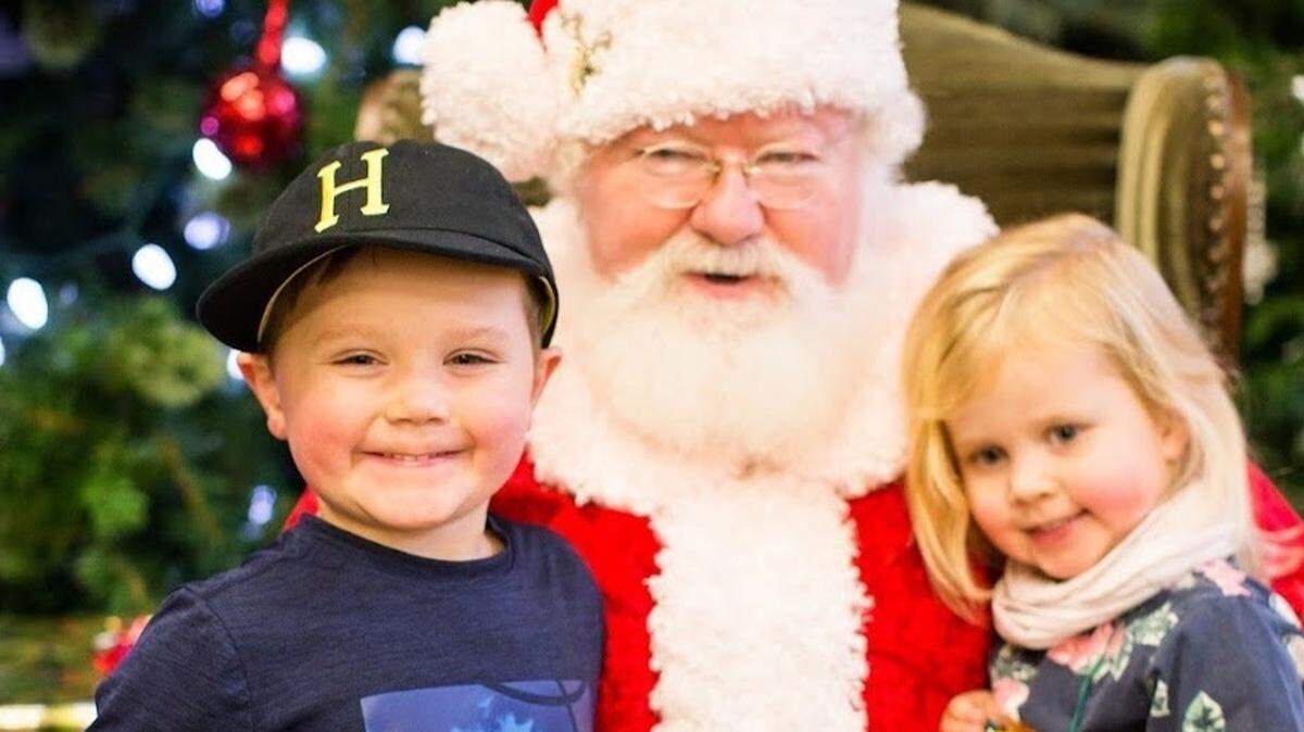 Children pose with Santa at Bellewood Farms and Distillery in Lynden.