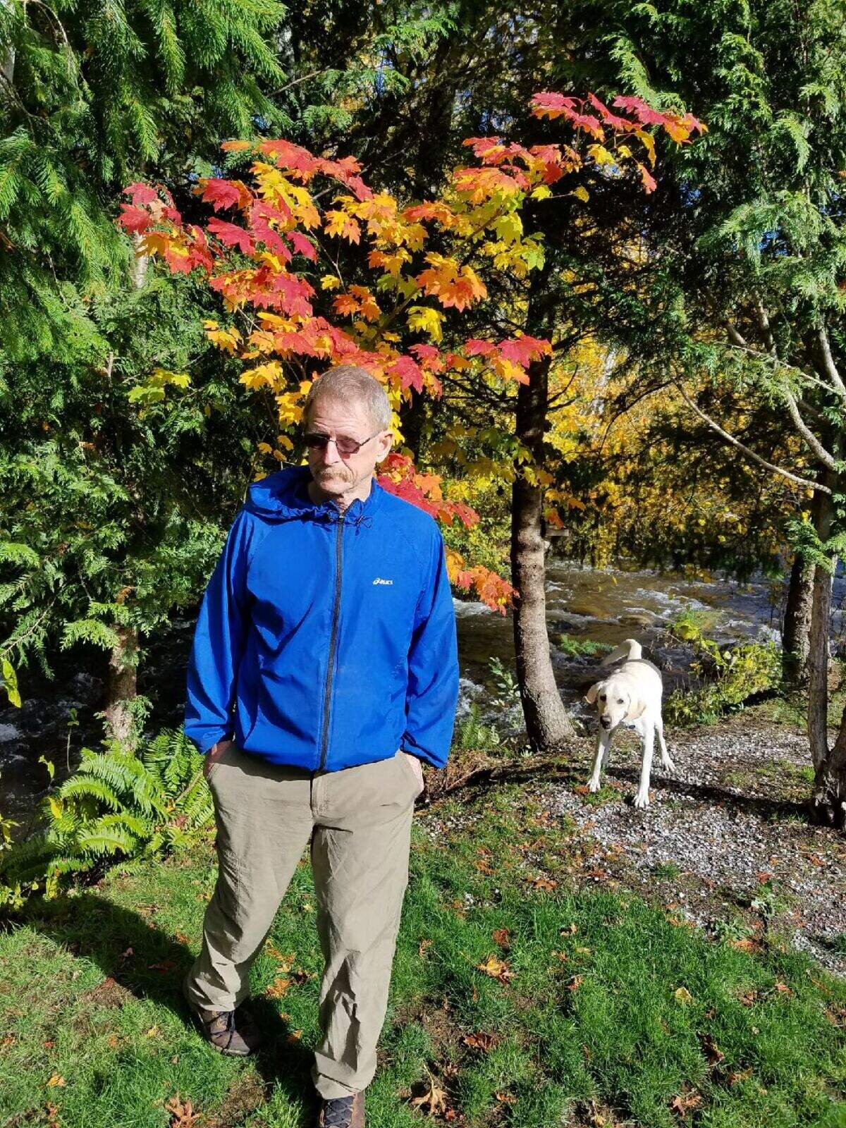 Don Alderson walks on his Bellingham property with his dog Cooper. Alderson lived his entire life in Bellingham, graduating from Belligham High in 1965, and worked for the Public Works water department.