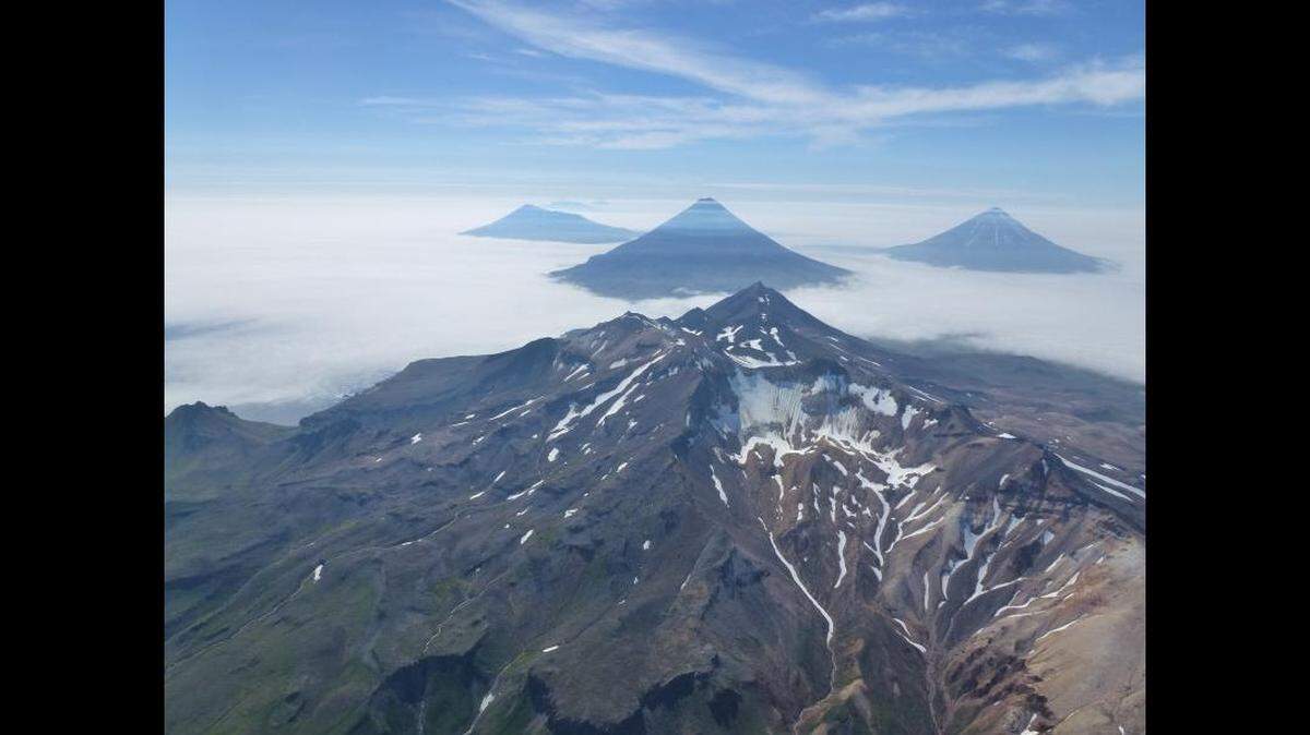 A giant, undiscovered volcano may exist beneath the waters surrounding a group of small islands off Alaska’s Aleutian chain, according to the American Geophysical Union.