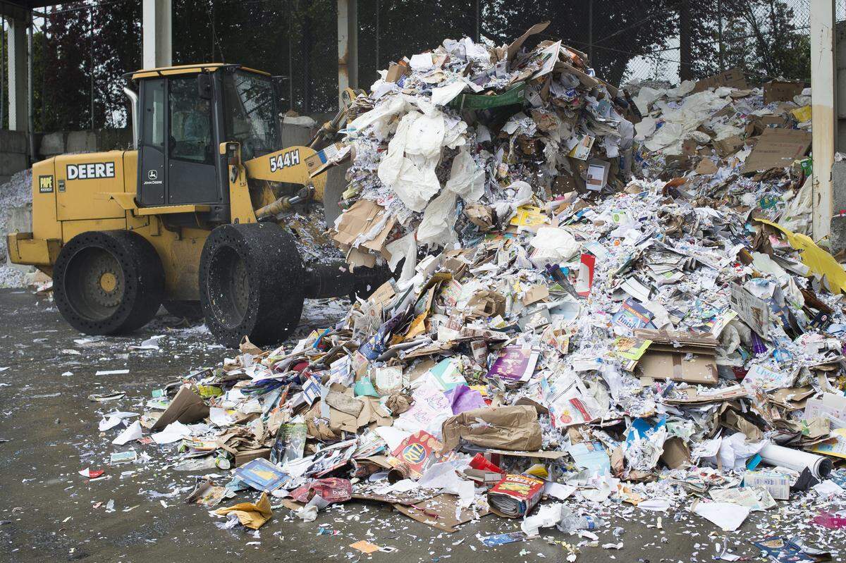 Paper is piled in the staging area for the paper baler at Northwest Recycling, Inc. in Bellingham.