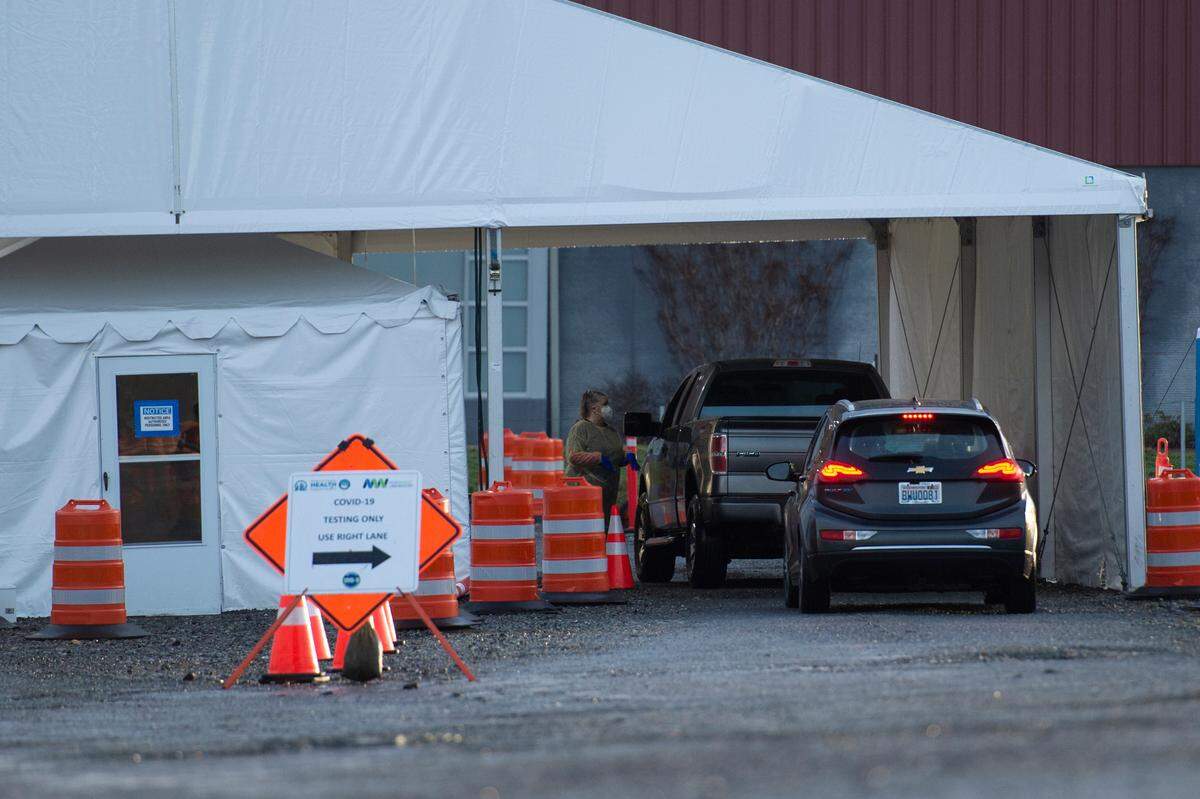 People line up in their cars to be tested for COVID-19 on Thursday, Jan. 13, in Bellingham. The Whatcom County Health Department operates the drive-through community testing site at Bellingham International Airport, Economy Lot B. Appointments are required for testing at the site.
