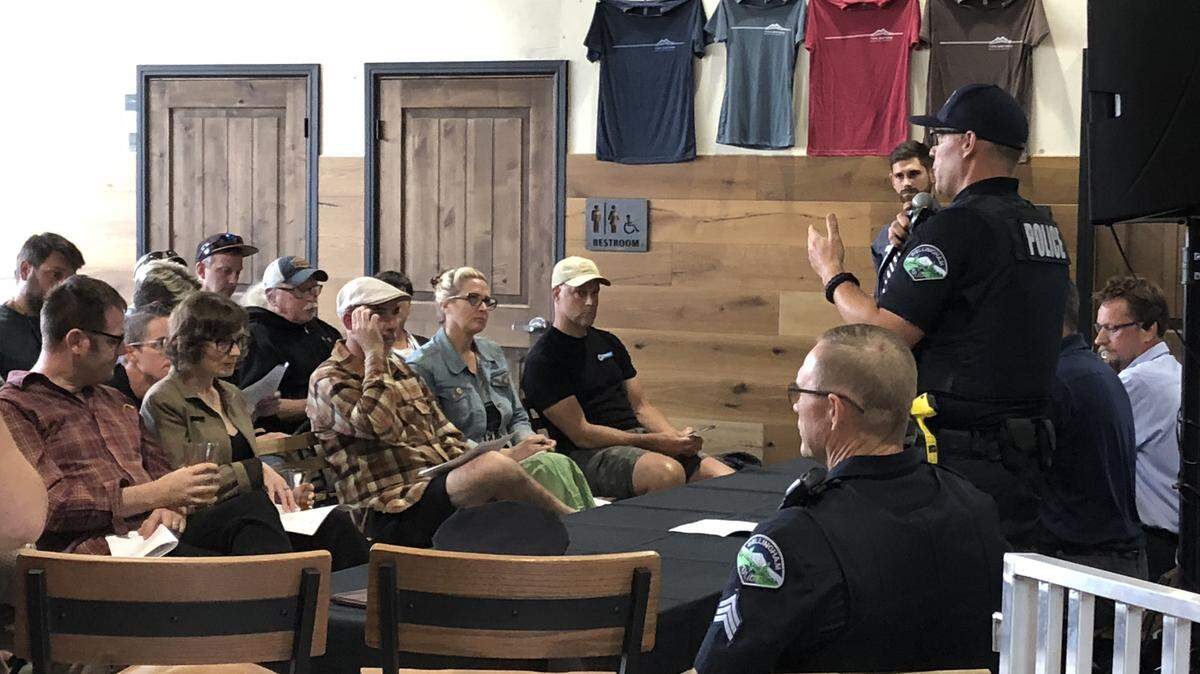 Neighborhood police officer Dante Alexander answers a question during the Sunnyland Neighborhood Association meeting Thursday evening at Twin Sisters Brewing. Neighbors had a variety of questions about the impact of the new brewery in the area, including parking and noise issues.