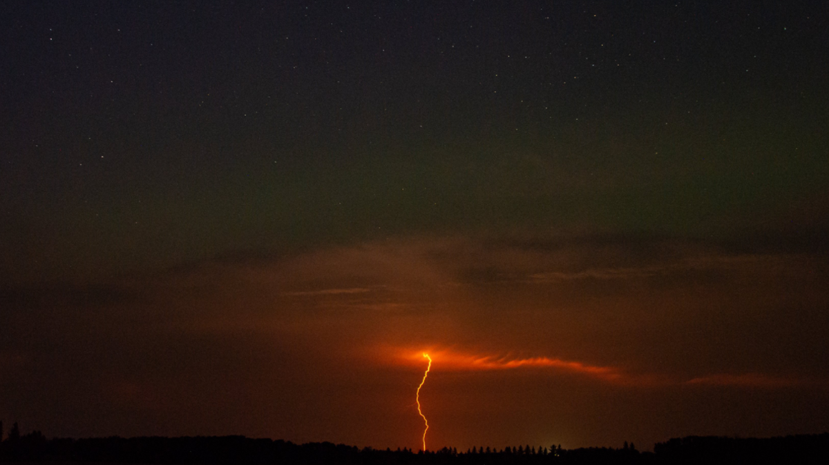 Photographer Deb Maluk was trying to capture images of the Aurora Borealis in southern Manitoba this week when she took multiple shots of rarely seen red lightning.