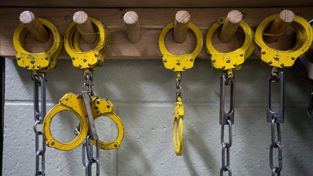 Handcuffs hang from a rack at the Whatcom County Jail in Bellingham, Washington.