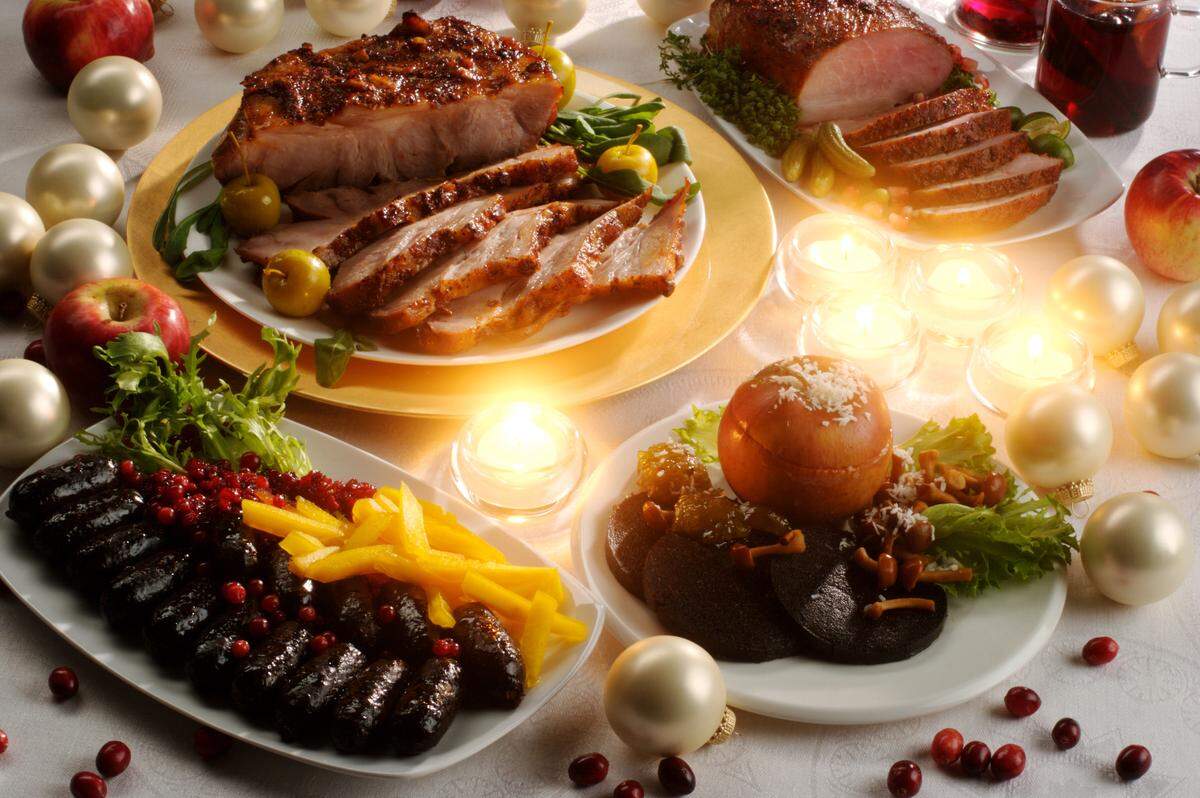Christmas table with roasted pork on the plate