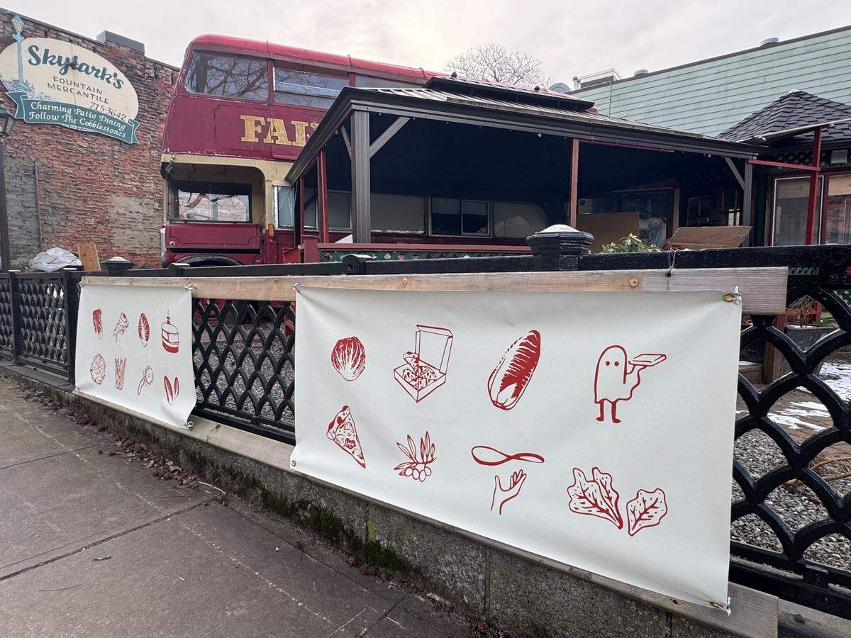 The Fairhaven red double-decker bus with Tam Tam Pizza signs on February 13, 2025 at 1020 Harris Ave.