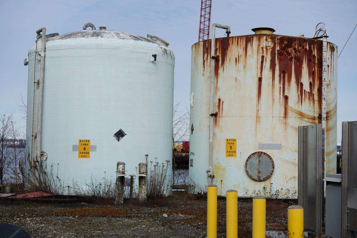 Old water tanks sit at the Fairhaven Shipyard on February 26, 2025. The tanks stand to be removed as part of a cleanup process at the Port-owned property that has been identified as a polluted site in Bellingham, Wash.