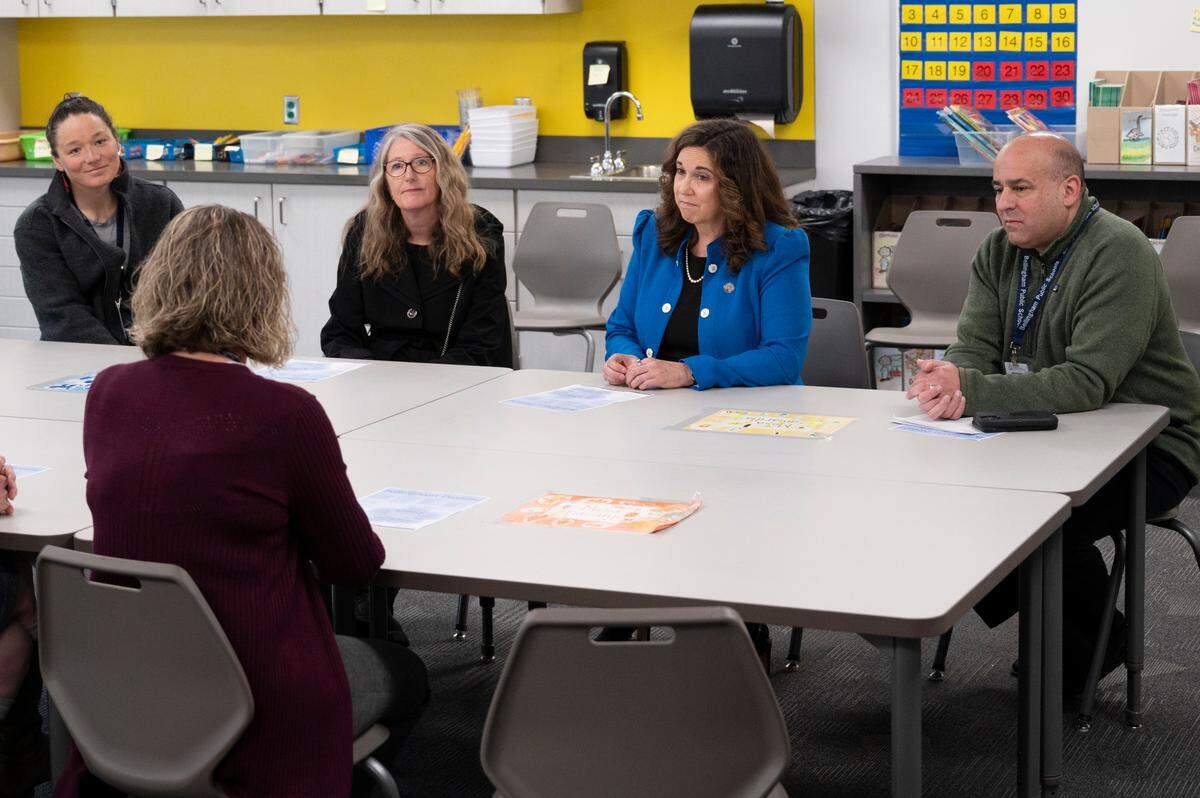 U.S. Deputy Secretary of Education Cindy Marten, second from right, listens to local educators about how American Rescue Plan dollars are being used for education on Tuesday, April 19, at Alderwood Elementary School school in Bellingham.