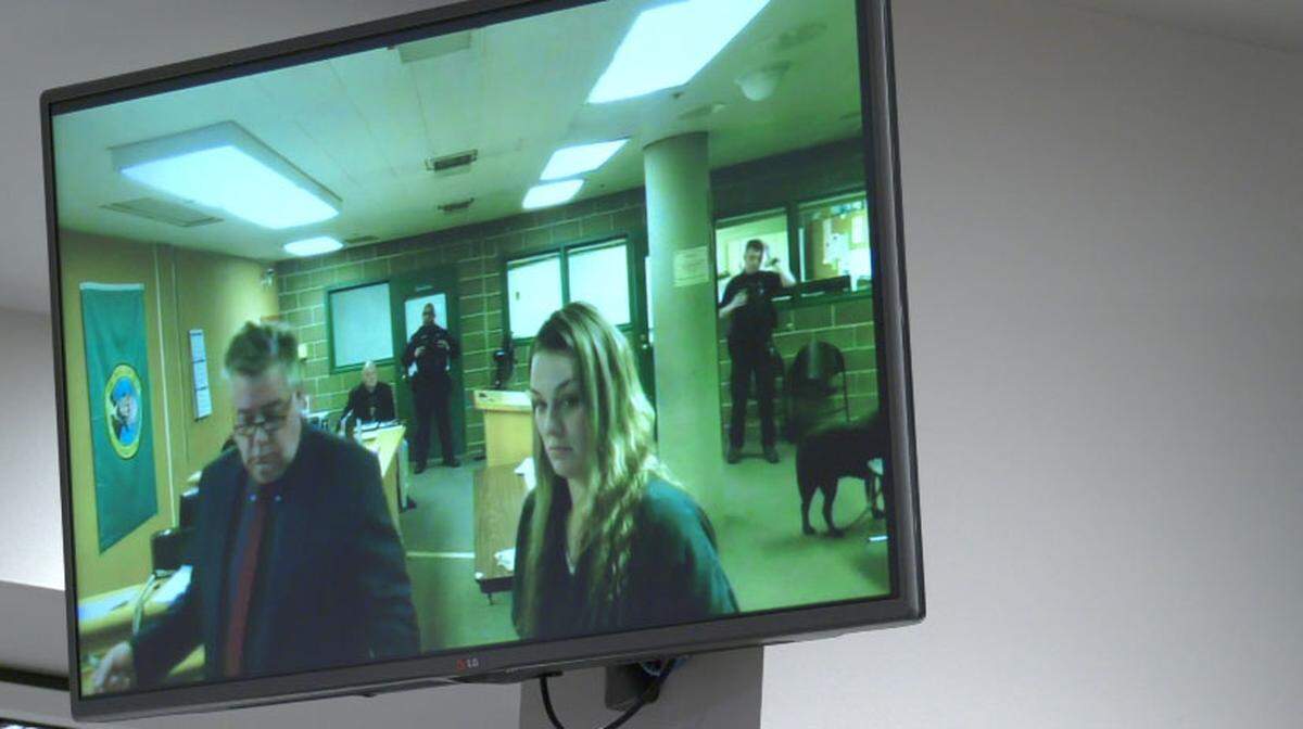 Kamee Nicole Dixon, right, makes her first appearance Friday in Whatcom County Superior Court with Starck Follis, director of the Whatcom County Public Defenders Office. Dixon was arrested by Bellingham Police Thursday on suspicion of second-degree murder of a 3-year-old girl.