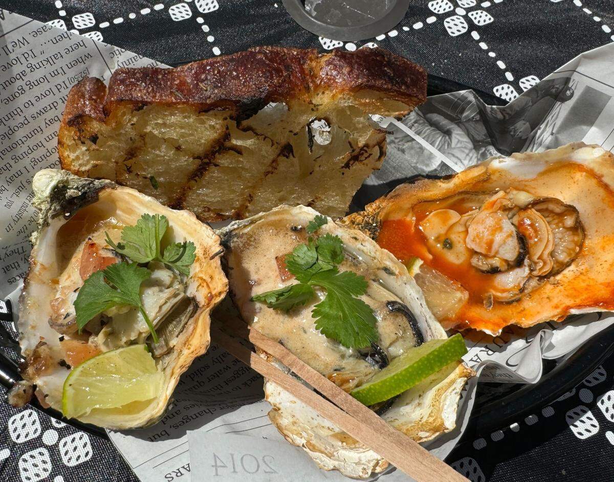 Grilled oysters from Drayton Harbor Oyster Company at 795 Peace Portal Drive in Blaine, Wash. on Friday, July 12, 2024.