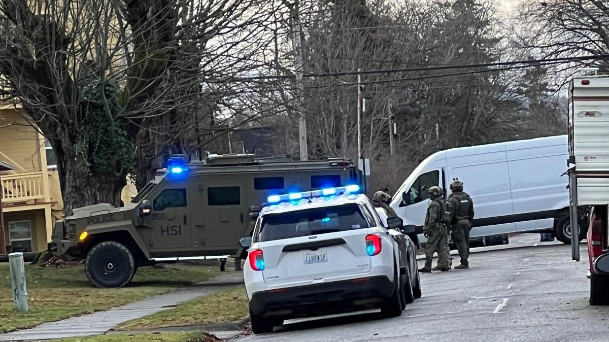 Homeland Security Investigations officers wait outside a house near York and Iron streets in Bellingham around 9 a.m. Wednesday, Nov. 30. An officer told The Bellingham Herald that they were arresting people on outstanding warrants.