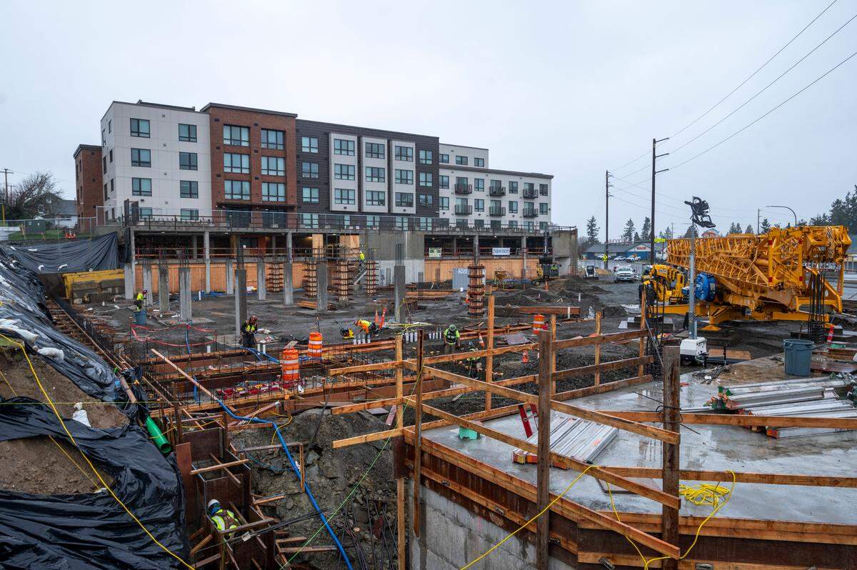 Foundation pillars for new housing are under construction along Samish Way on Thursday, Feb. 3, in Bellingham. The foundation is for the second phase of Samish Commons on the site of the former Aloha Motel property. Phase 2 has two buildings that will total 103 residential units.