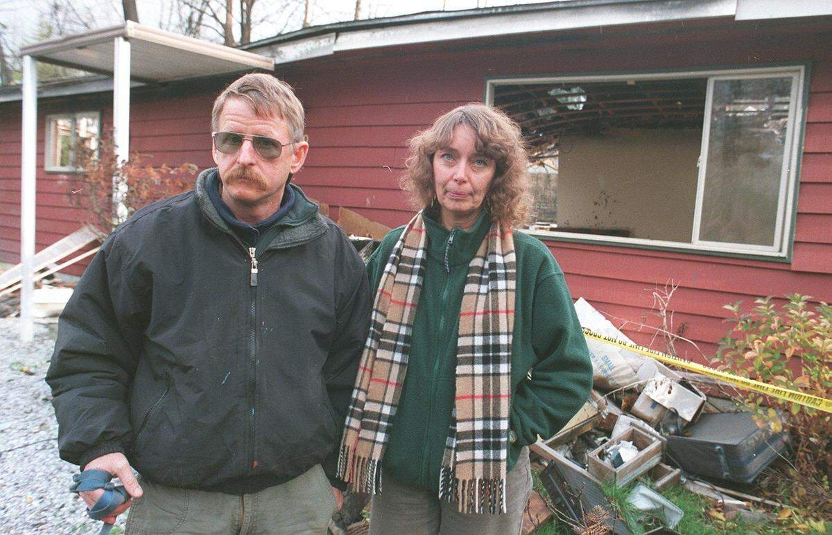 Don Alderson, who was killed in October 2018, and girlfriend Mayrus Helburg stand in front of the remains of Alderson’s home on Valencia Street in 1999. The house, which sits near Whatcom Creek, was destroyed by the 1999 pipeline explosion, but he was able to rebuild on the same piece of property.