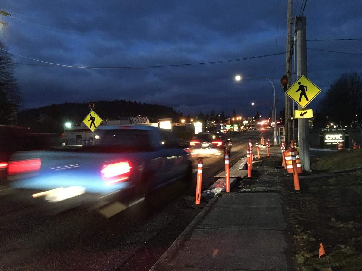 Morning commuters drive past a pedestrian crossing on Lakeway Drive near Orleans Street, where the flashing yellow signals are being replaced with red lights that will require traffic to stop rather than simply yield.