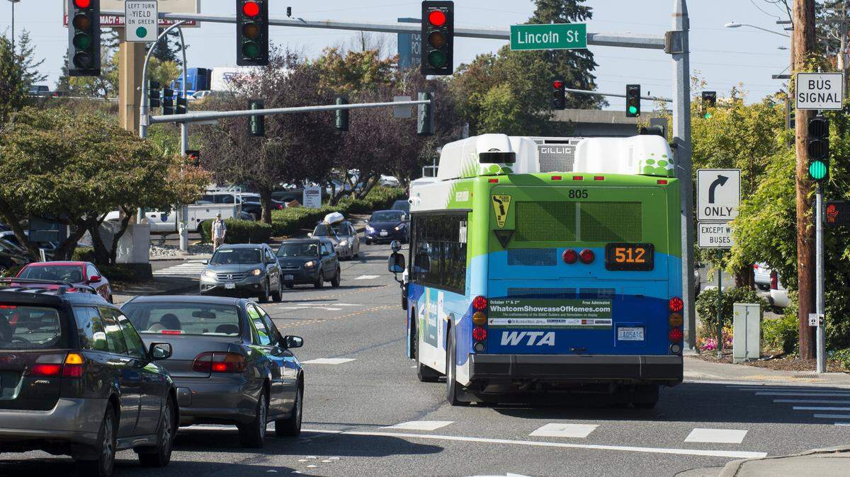 Washington state law requires drivers to yield to transit buses that have signaled their intention to enter traffic.