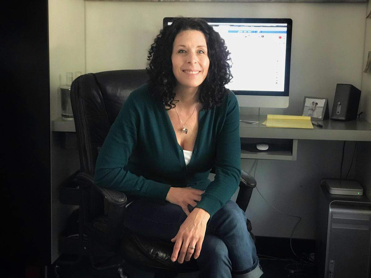 Sandi Heinrich sits in her Bellingham home March 18. It’s from here that Heinrich runs a Facebook group dedicated to Whatcom County neighbors helping one another with essential services amid the novel coronavirus outbreak.