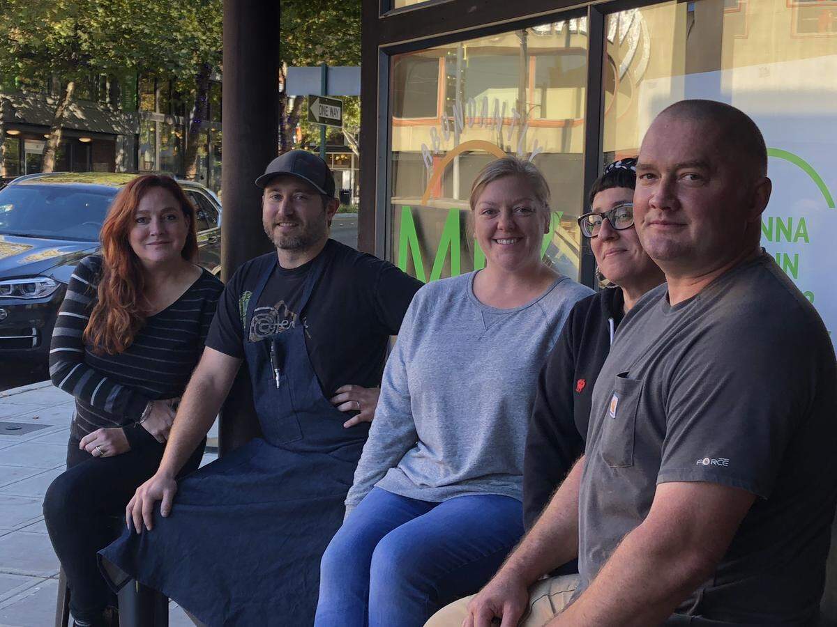 Mix owner Helen Neville, left, Executive Chef Ian Thompson, General Manager Megan Murray, Kitchen and Beverage Manager Jen Martinez and Otis Jordan of Bay City Construction prepare for the new restaurant on Holly Street in downtown Bellingham.