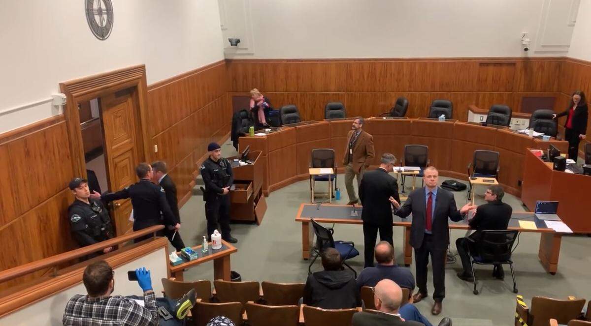 Anti-tax activist Tim Eyman gestures to the crowd in a screenshot from a pubic YouTube video that Eyman also shared on his social media when he was running for governor. Eyman demanded to speak at the March 23, 2020, meeting of the Bellingham City Council, where council members were updating provisions of the mayor’s emergency powers. Eyman falsely claimed that the city was getting ready to end gun sales and prevent open carry of firearms throughout the city.