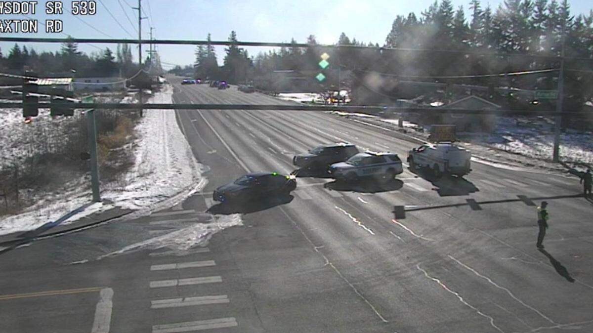 A Washington State Department of Transportation traffic camera shows a police roadblock at Guide Meridian and Axton Road north of Bellingham at about 1:30 p.m. Tuesday, Feb. 11.