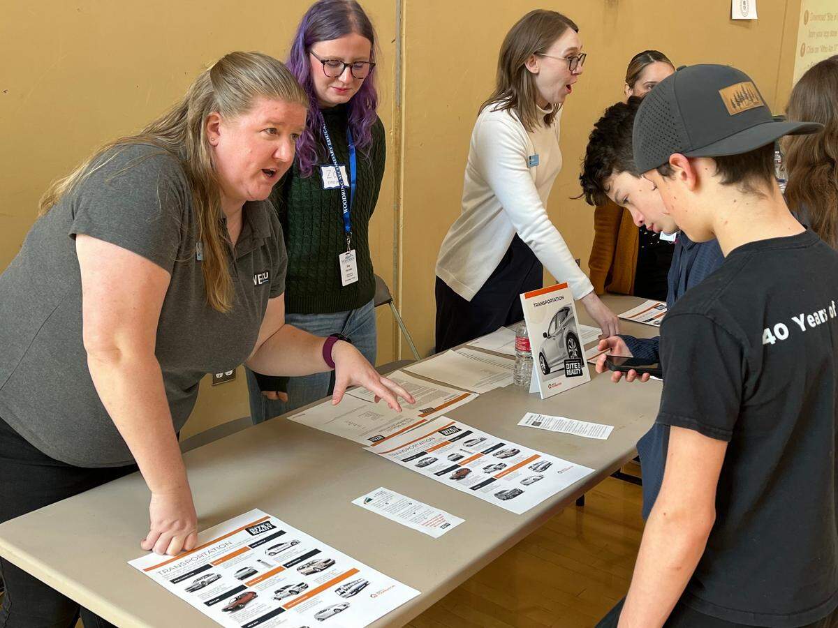 A WECU representative tried to upsell imaginary cars to students at Shuksan Middle School who participated in the Bite of Reality financial education event on April 1. The event is designed to help students build money management and budgeting skills while facing external pressure to spend more than they have.