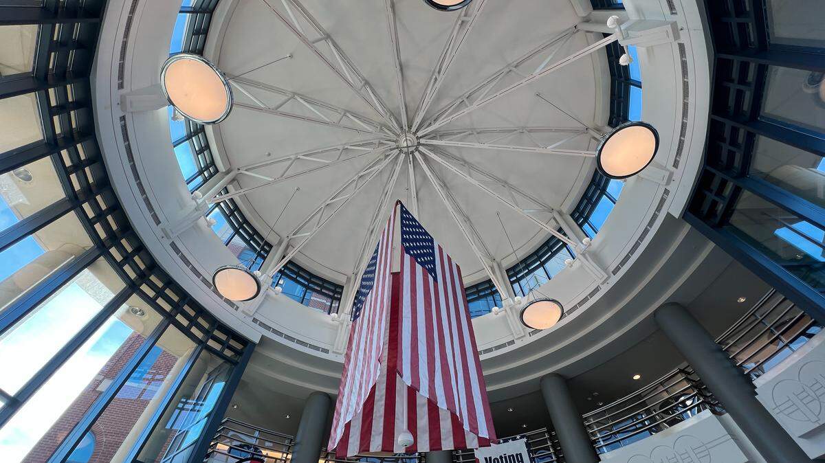 An American flag hangs in the rotunda of the Whatcom County Courthouse in Bellingham on Election Day, Nov. 4, 2025. Ballot boxes, voting booths and same-day voter registration are available in the courthouse at the Auditor’s Office.