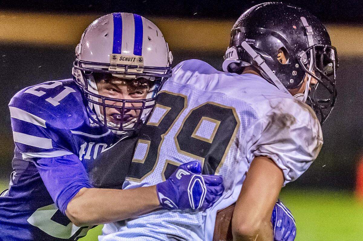 Meridian wide receiver Kevin Galiano (89) tries to break free of a tack by Nooksack Valley safety Scout Whittern on Sept. 21. Galiano is one of what coach Bob Ames calls his “Swiss Army knives” as the Trojans prepare to host Colville in the Class 1A state quarterfinals Saturday at Civic Stadium.