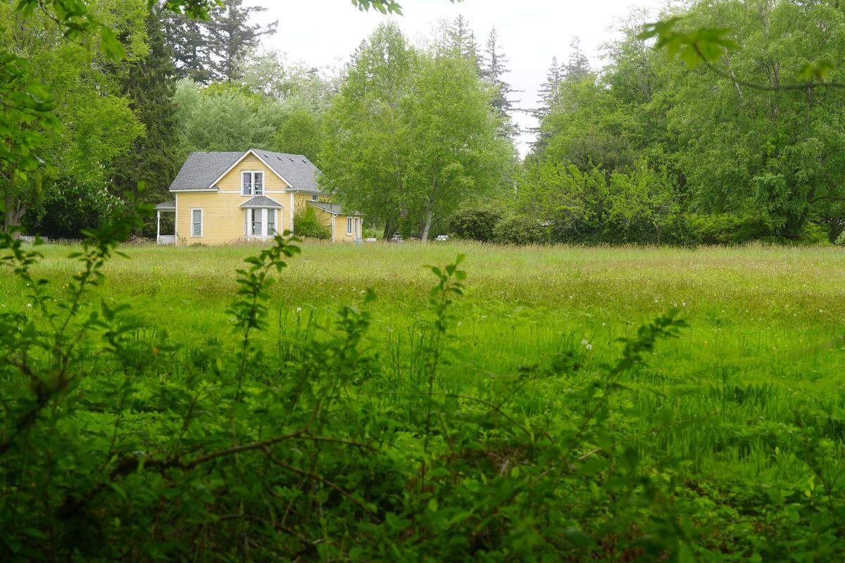 A farmhouse sits on a 4.5-acre property in the Samish neighborhood on the corner of 40th Street and Wilkin Street, just northwest of Lake Padden in Bellingham. A 29-unit subdivision development is proposed for the site that would include a mix of townhomes and detached, single-family homes.