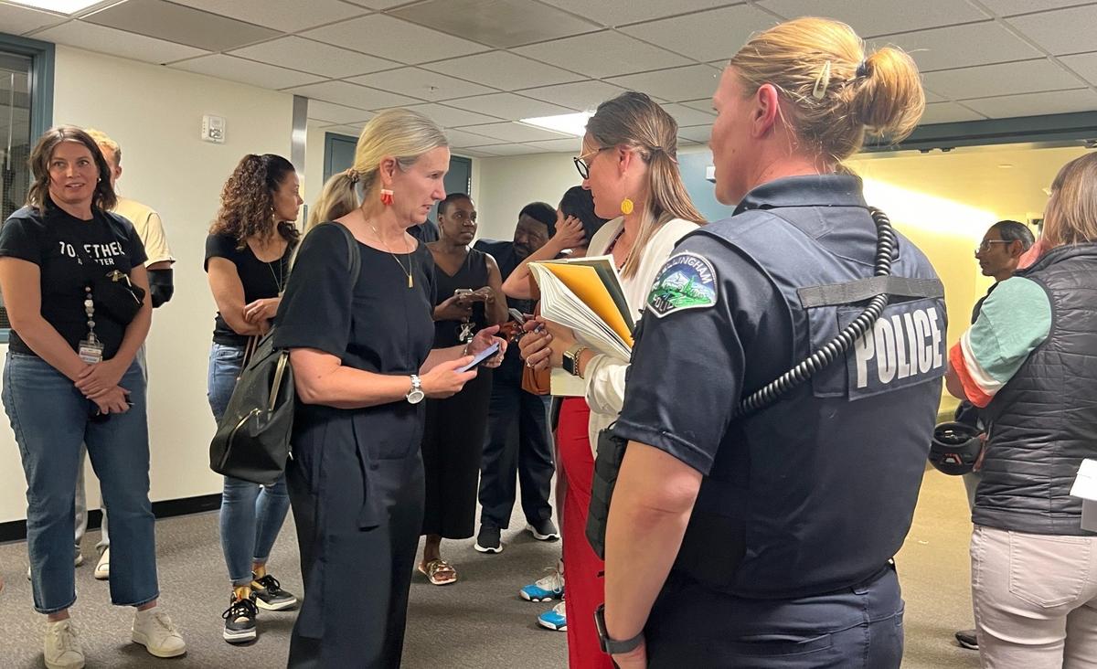 Bellingham Mayor Kim Lund, third from left, chats with others after a court hearing Thursday where $500,000 bail was set for Paul Bittner, who is facing charges related to an alleged racially motivated attack on an 11-year-old boy.