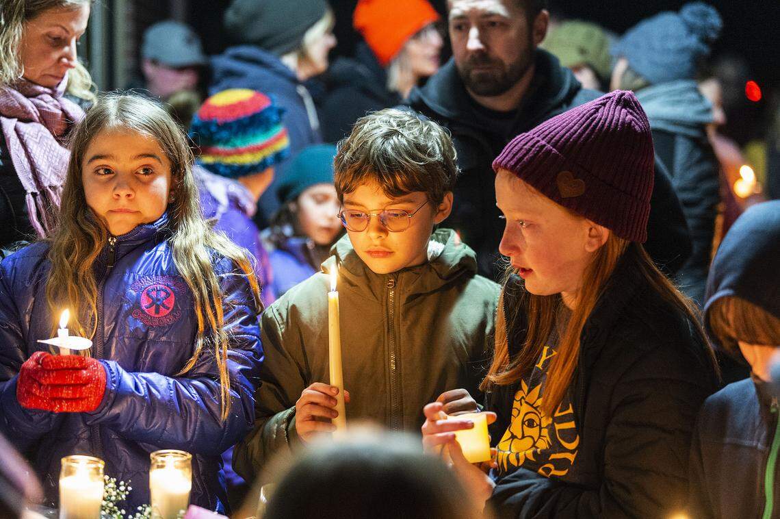 More than 200 students, teachers, parents and administrators attend a vigil for slain school principal Lynn Heimsoth at Sunnyland Elementary School on Friday evening in Bellingham.