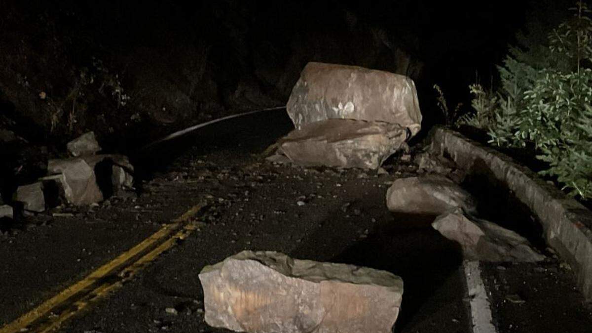 Several large boulders, some of them the size of cars, were blocking both lanes of Chuckanut Drive (State Route 11) south of Bellingham, after a landslide Saturday.