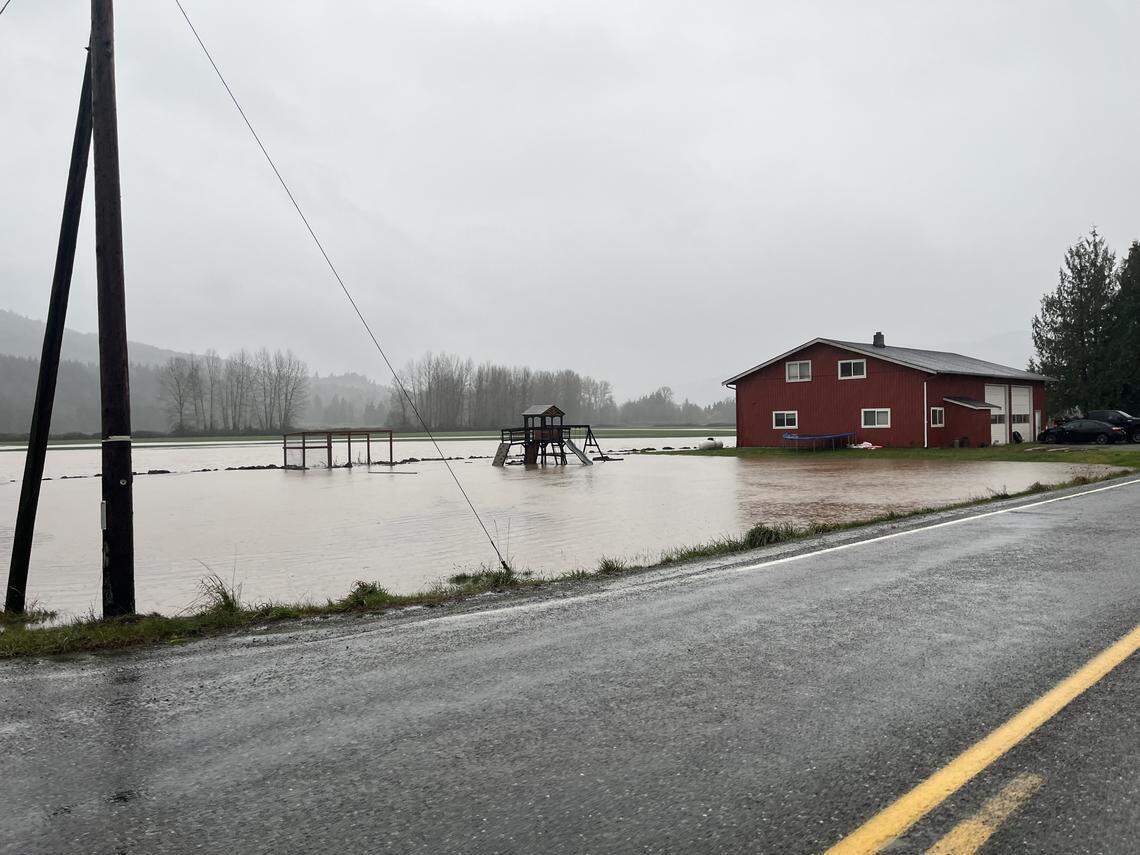 A house off Siper Road south of Everson was surrounded by water on December 10, 2025, as flooding threatened low-lying areas of Whatcom County.