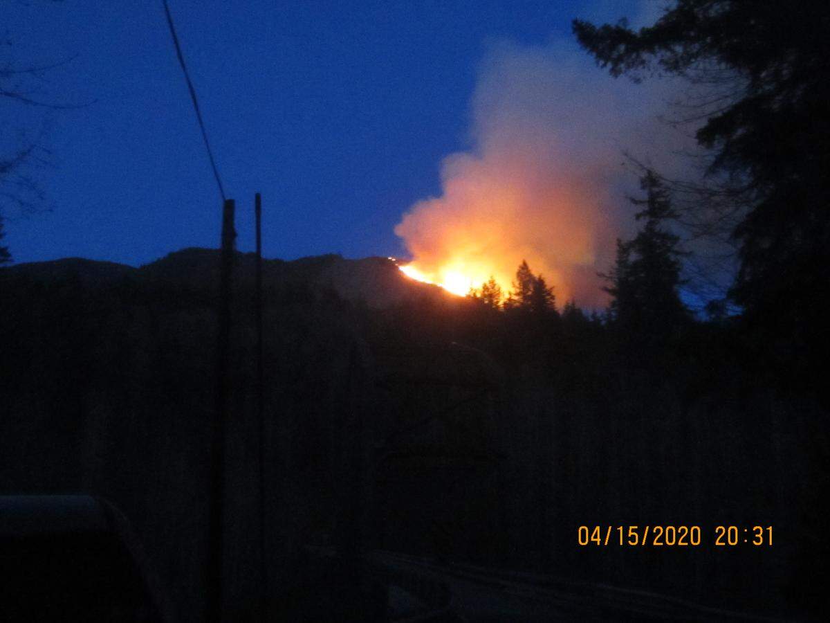 A large wildfire that was visible in parts of Whatcom and Skagit counties burns Wednesday evening in an area east of Van Zandt near the Middle Fork of the Nooksack River.