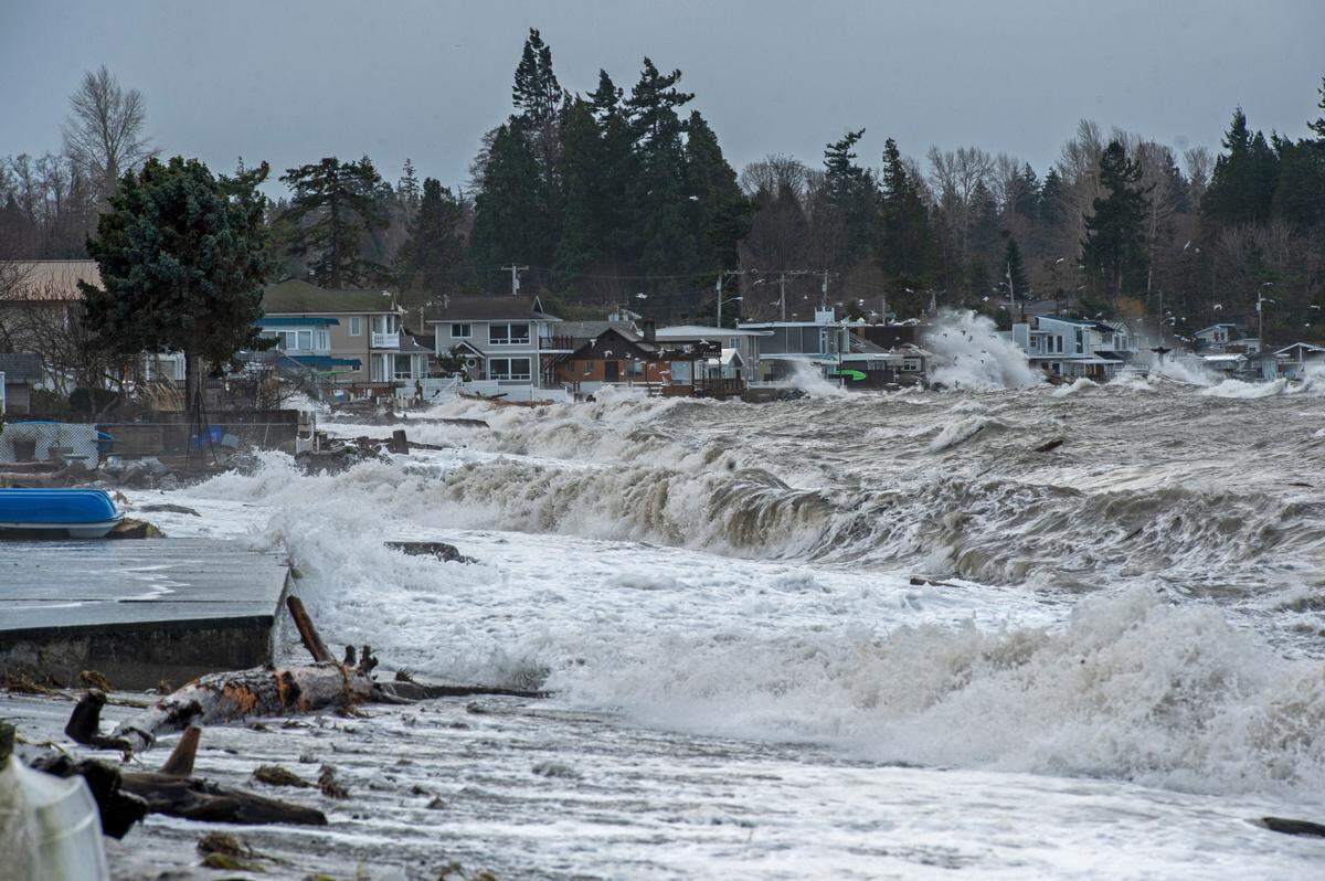 Waves batter the coastline in Birch Bay during a king tide on Friday, Jan. 7, 2022, in Whatcom County near Bellingham, Wash.