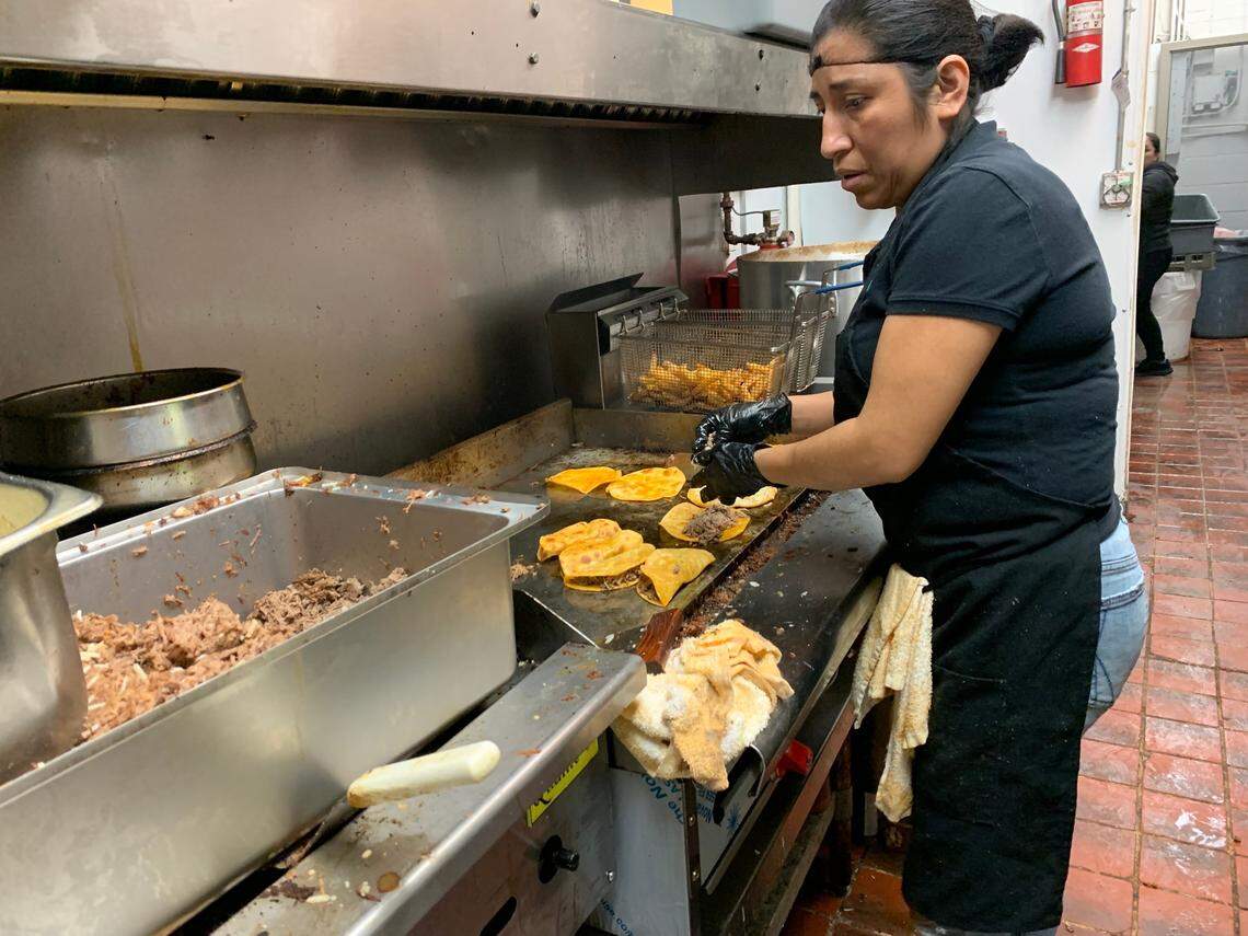 Yadira Castillo works the grill at Birrieria Tijuana, on Tuesday, Dec. 13. The restaurant opened its long-awaited Bellingham location at 3040 Northwest Ave. Monday, Dec. 12.